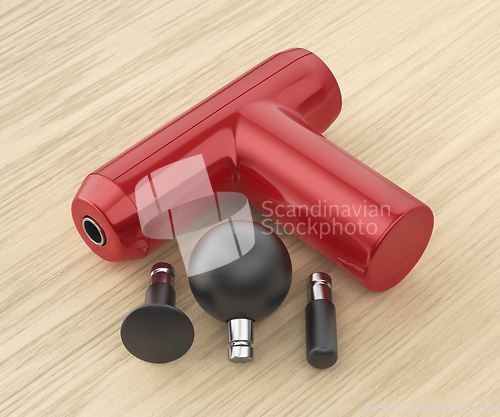 Image of Massage gun with various massage heads