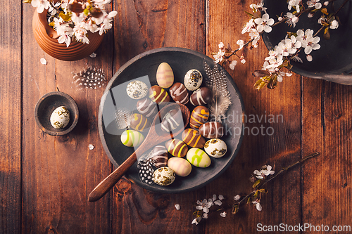 Image of Easter place setting with sweet chocolate eggs, spring celebration