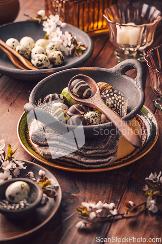 Image of Easter place setting with sweet chocolate eggs, spring celebration