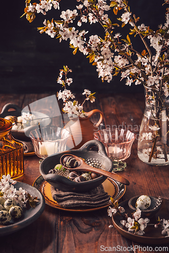 Image of Easter place setting with sweet chocolate eggs, spring celebration