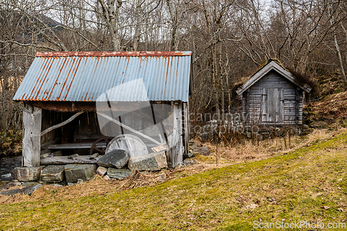 Image of Old wooden structures reveal a story of bygone days beside a gen