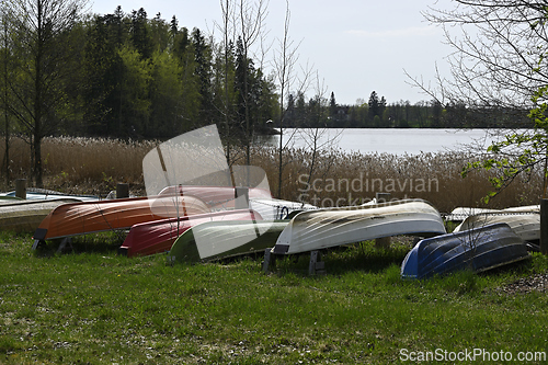 Image of overturned boats on the lake shore 