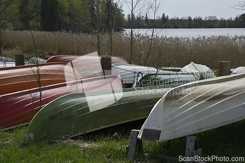 Image of overturned boats on the lake shore 