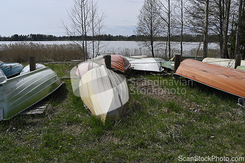 Image of overturned boats on the lake shore 