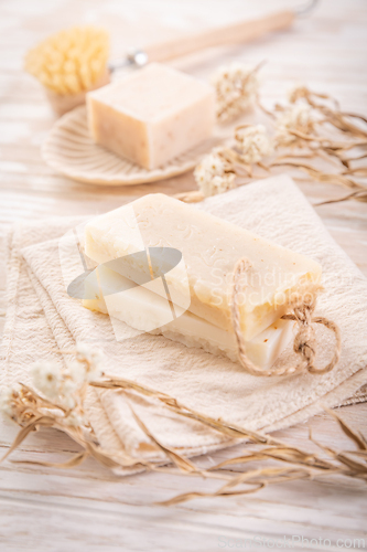 Image of Handmade natural soaps on beige background