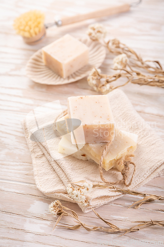 Image of Handmade natural soaps on beige background