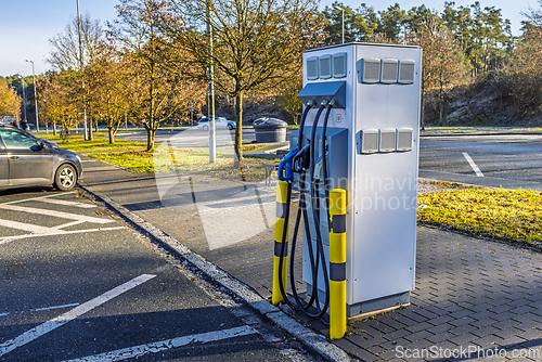 Image of Power supply for electric car charging, charger at parking lot near the motorway