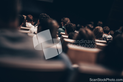 Image of Rear view of unrecognizable people in audience at the conference hall. Business and entrepreneurship symposium.