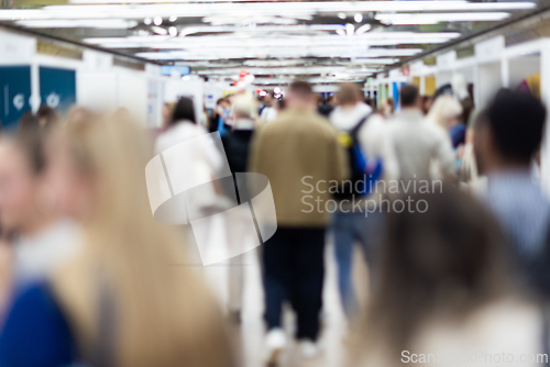 Image of Abstract blurred people at exhibition hall of expo event trade show. Business convention show or job fair. Business concept background.