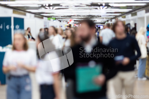 Image of Abstract blurred people at exhibition hall of expo event trade show. Business convention show or job fair. Business concept background.