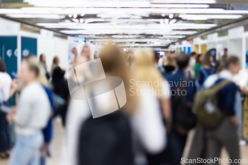 Image of Abstract blurred people at exhibition hall of expo event trade show. Business convention show or job fair. Business concept background.