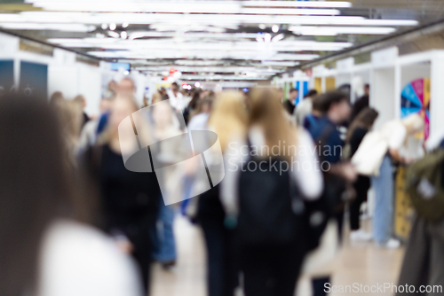Image of Abstract blurred people at exhibition hall of expo event trade show. Business convention show or job fair. Business concept background.