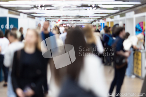 Image of Abstract blurred people at exhibition hall of expo event trade show. Business convention show or job fair. Business concept background.
