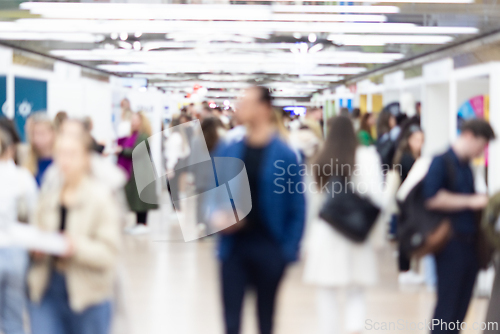 Image of Abstract blurred people at exhibition hall of expo event trade show. Business convention show or job fair. Business concept background.