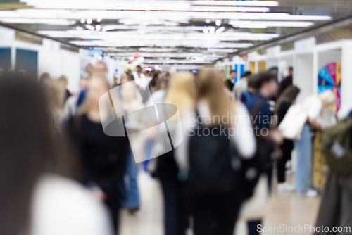 Image of Abstract blurred people at exhibition hall of expo event trade show. Business convention show or job fair. Business concept background.