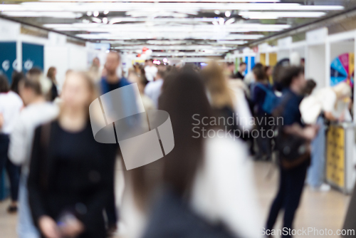 Image of Abstract blurred people at exhibition hall of expo event trade show. Business convention show or job fair. Business concept background.