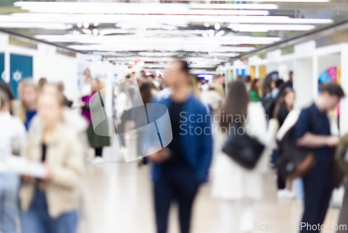 Image of Abstract blurred people at exhibition hall of expo event trade show. Business convention show or job fair. Business concept background.