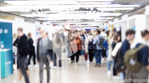 Image of Abstract blurred people at exhibition hall of expo event trade show. Business convention show or job fair. Business concept background.