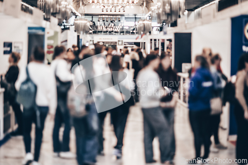 Image of Abstract blurred people at exhibition hall of expo event trade show. Business convention show or job fair. Business concept background.