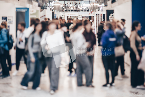 Image of Abstract blurred people at exhibition hall of expo event trade show. Business convention show or job fair. Business concept background.