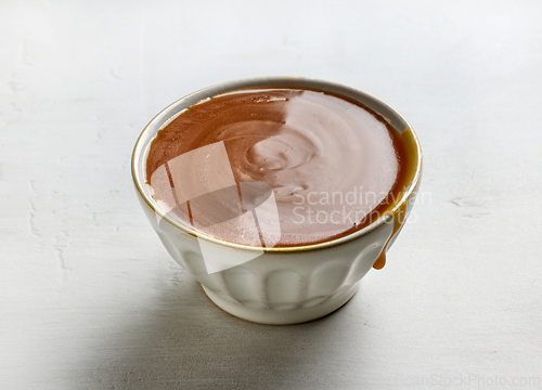 Image of bowl of freshly cooked homemade caramel sauce