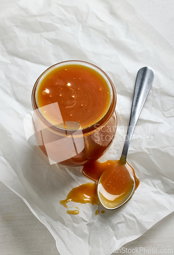 Image of freshly cooked homemade caramel sauce in jar