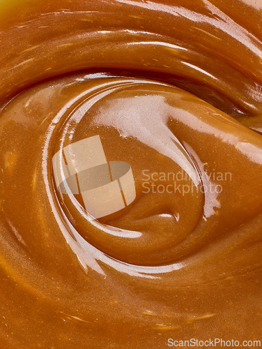 Image of freshly cooked caramel sauce background