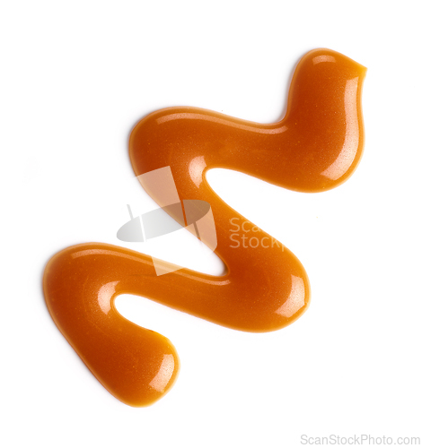 Image of caramel sauce on white background