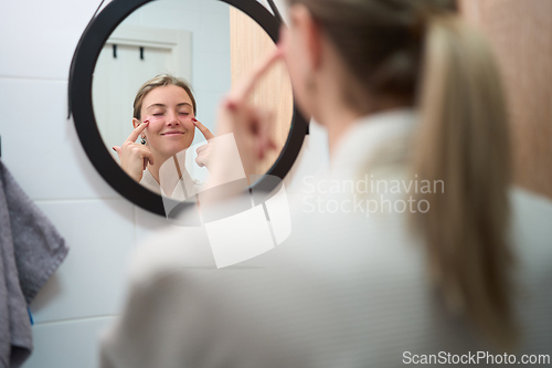 Image of A Gentle Pause While Applying Eye Patches