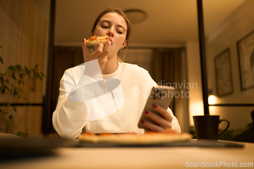 Image of Soft Glow of the Phone in a Quiet Bedroom