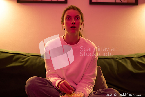 Image of Drawn Into the Screen Under Soft Pink Lighting