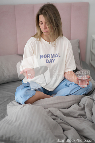 Image of Preparing to Take Medication in Soft Morning Light