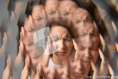 Image of Woman pressing temples in pain with circular motion visual effect of migraine