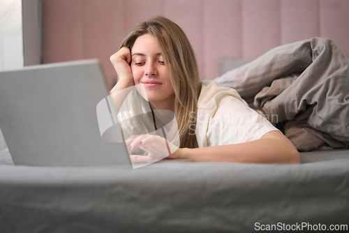 Image of Easygoing Laptop Browsing in a Calm Bedroom