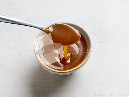 Image of bowl of freshly cooked homemade caramel sauce