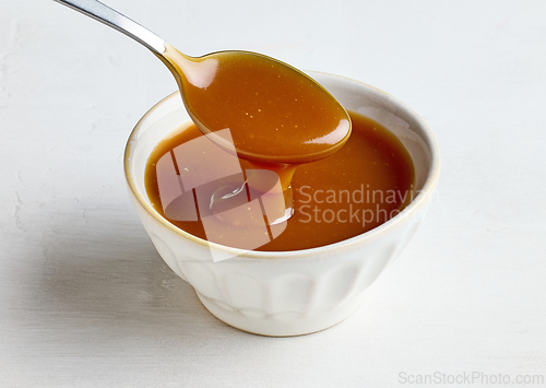 Image of bowl of freshly cooked homemade caramel sauce