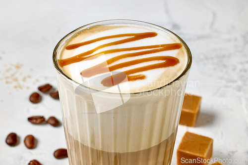 Image of closeup of caramel latte coffee glass