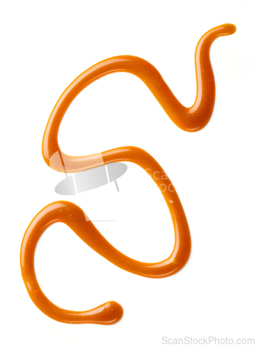 Image of caramel sauce on white background