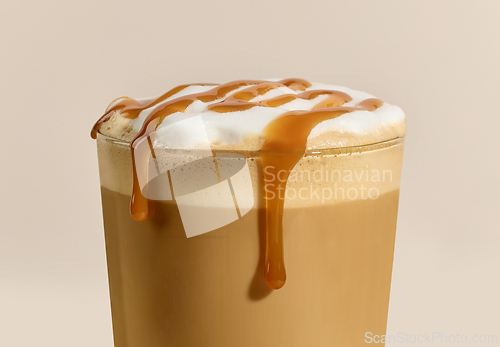 Image of closeup of caramel latte coffee glass