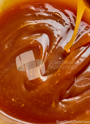 Image of freshly cooked caramel sauce background