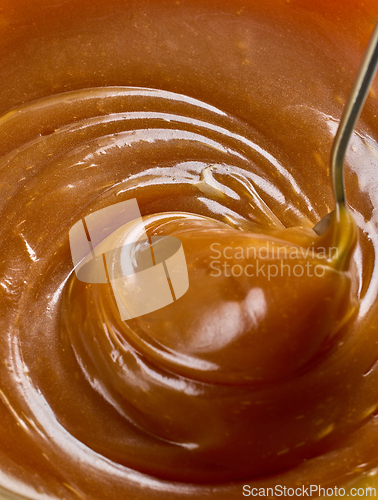 Image of freshly cooked caramel sauce background