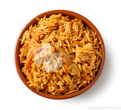 Image of ceramic bowl of spicy rice with chicken meat and carrots isolate