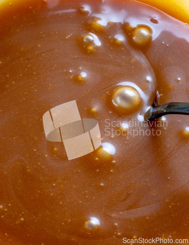 Image of freshly cooked caramel sauce background