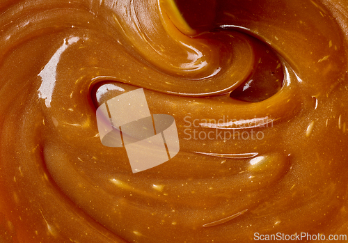 Image of freshly cooked caramel sauce background