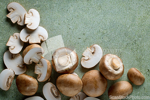 Image of fresh mushrooms on green background