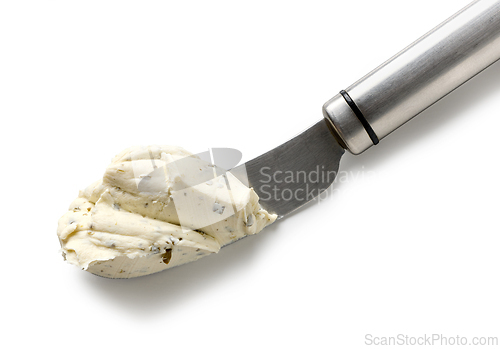 Image of fresh cream cheese on a knife