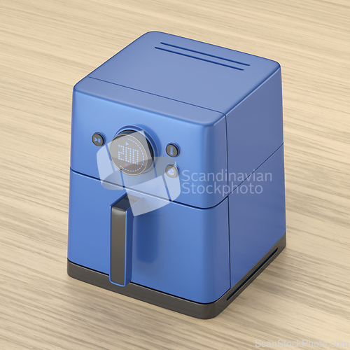 Image of Air fryer on wooden table