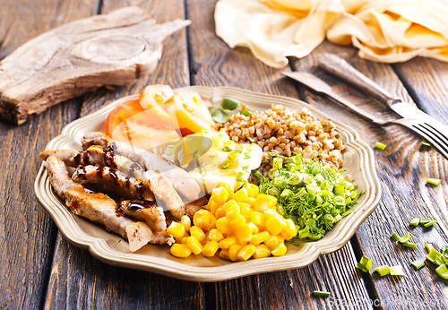Image of salad with meat and vegetables on plate