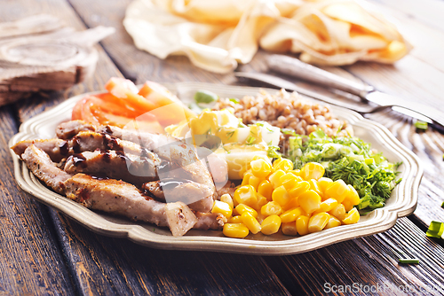 Image of salad with meat and vegetables on plate