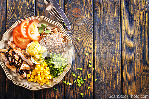 Image of salad with meat and vegetables on plate